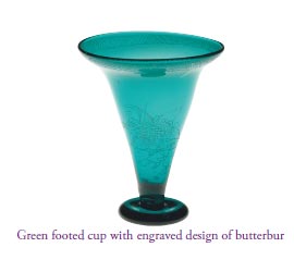 Green footed cup with engraved design of butterbur